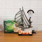 Decorative ship shaped clock lamp placed on office desk for decor