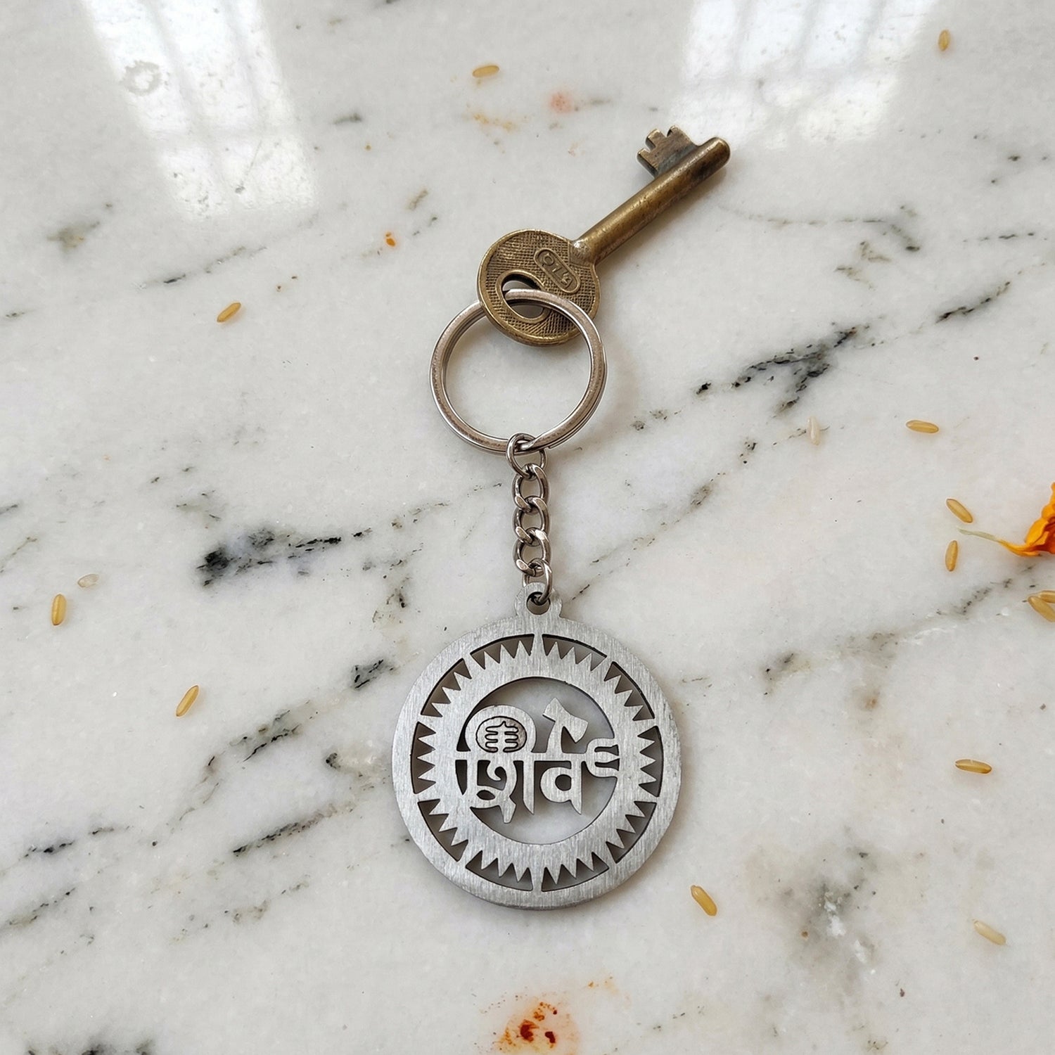 Metal Shiv keychain showcased with keys