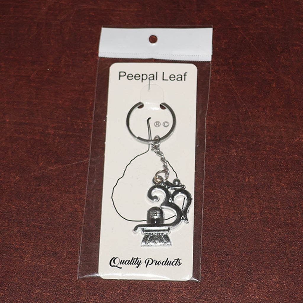 Spiritual metal keychain featuring Om symbol and Shivling icon
