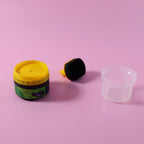 Black shoe polish cream container shown with open lid