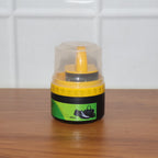 Black shoe polish cream and sponge applicator ready for use