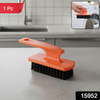 Close-up of multipurpose shoe cleaning brush showing comfortable grip handle
