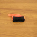 Shoe cleaning brush in live use cleaning sneakers and household surfaces