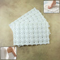 Set of four anti-slip bathroom massage mats with strong suction cups