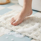 Bathroom floor mat featuring drainage holes for fast drying