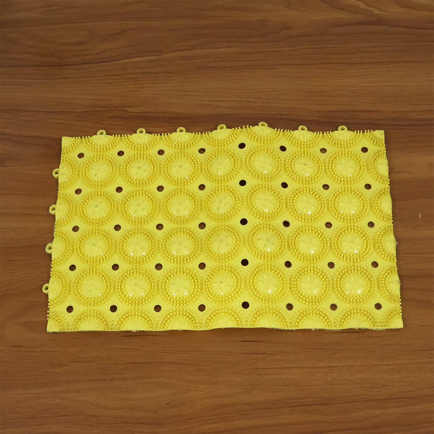 Flexible anti-slip bathroom mat unrolled and ready to use