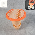 Plastic drain strainer with hair catcher installed in a bathroom shower drain