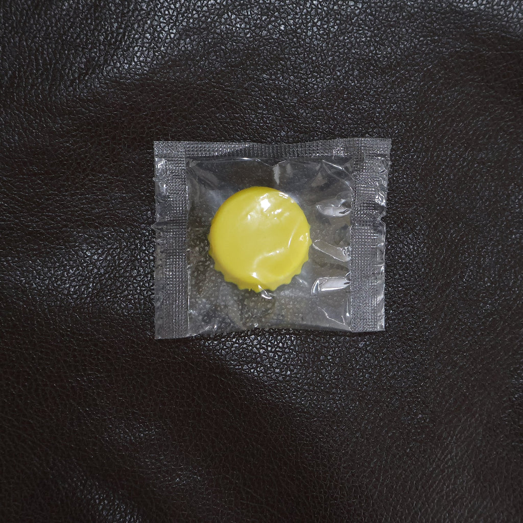 Reusable silicone bottle cap cover in use