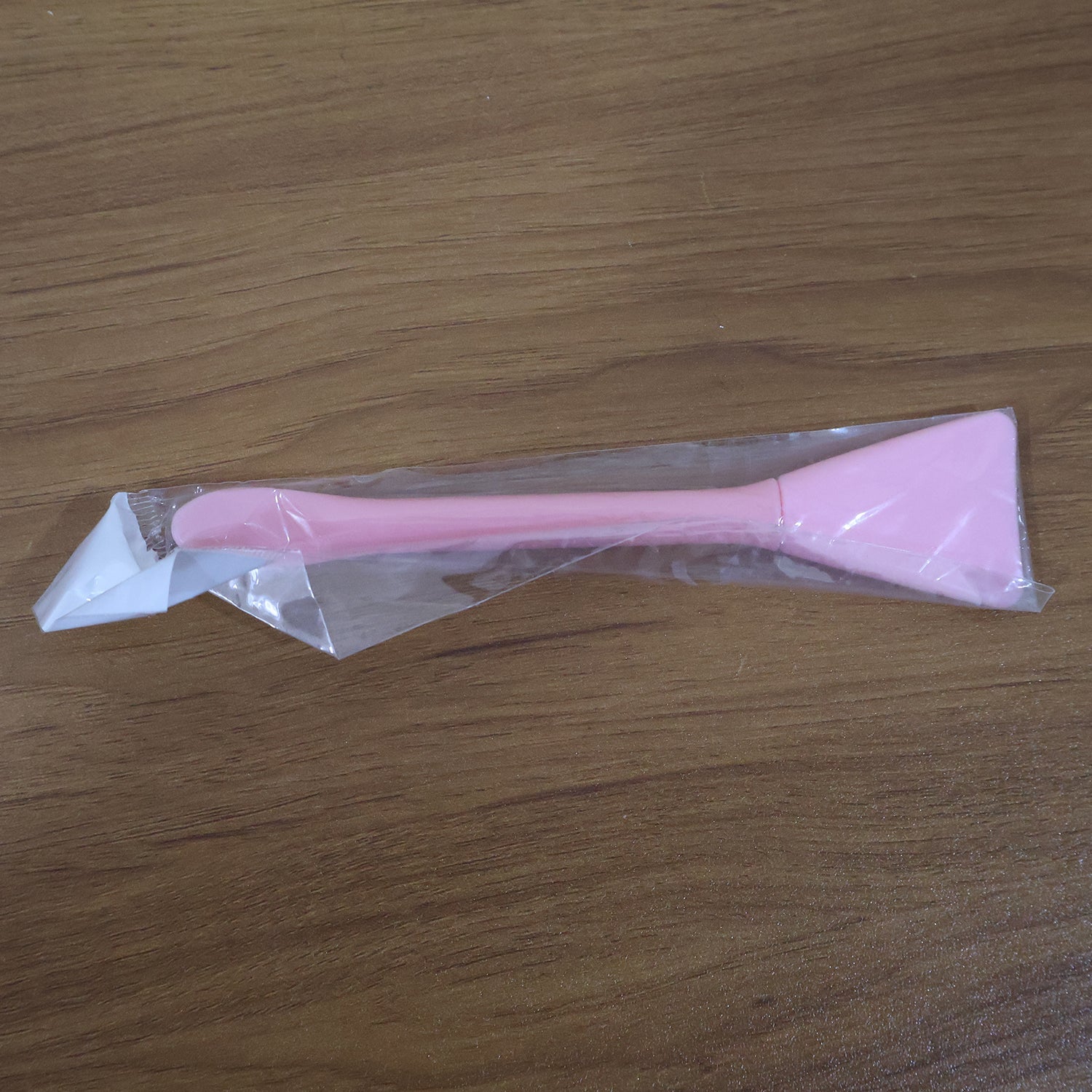 Close-up image of silicone facial mask applicator tool