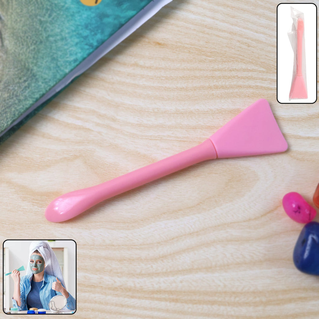 Silicone facial mask applicator spatula on white background for hygienic use
