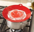 Silicone Spill Stopper Lid preventing boil-over on a cooking pot.