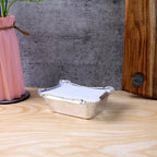 Open disposable aluminium container showing interior space for food