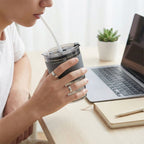 Plastic tumbler filled with a refreshing beverage, ready for use at home or office.