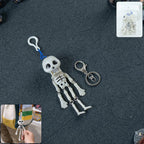 Skeleton doll keychain with movable limbs on a keyring