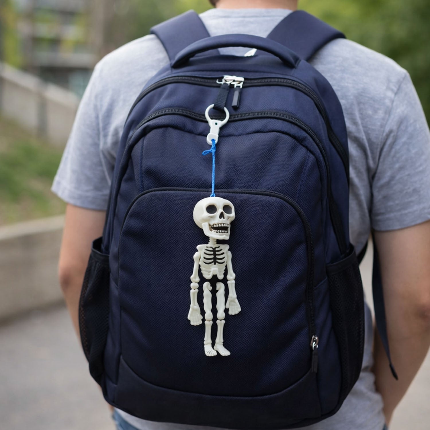 Skeleton doll keychain shown as a playful toy keyring