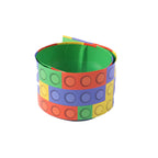 Close-up of colorful block pattern on vibrant snap slap bracelet
