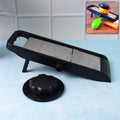 Supermom adjustable slicer in black and silver, perfect for quick vegetable preparation.