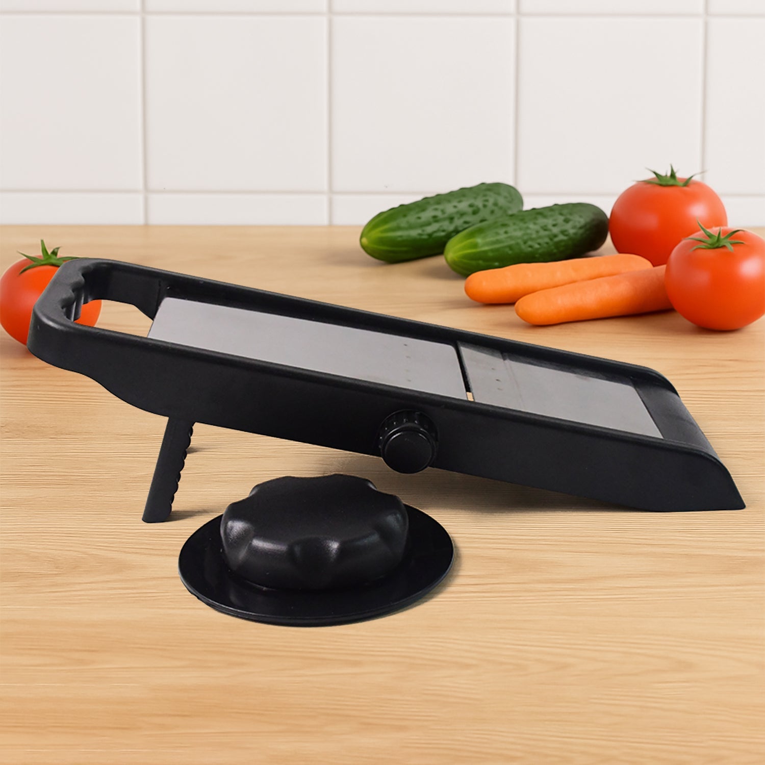 Hand demonstrating slicing a cucumber with the Supermom adjustable kitchen slicer.