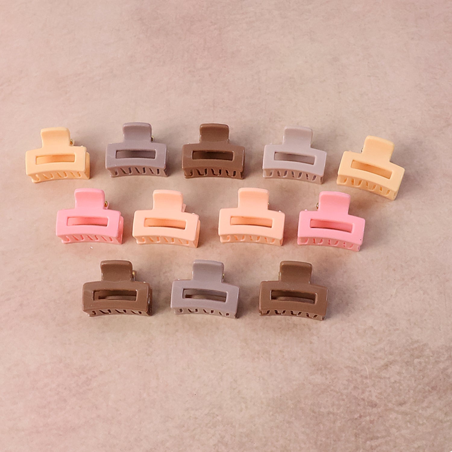 Mini hair claw clip set laid out for daily hair styling use