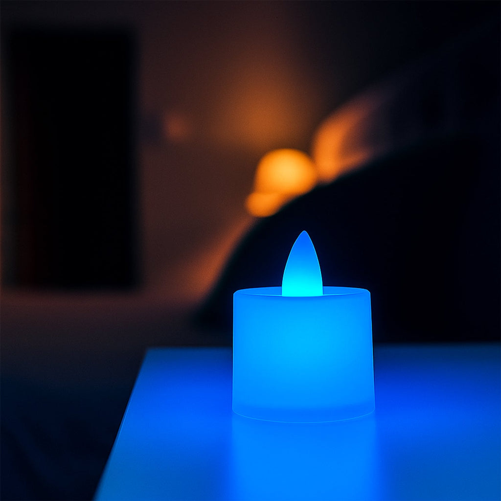 Blue LED tea light candle showing flickering glow in a dark setting