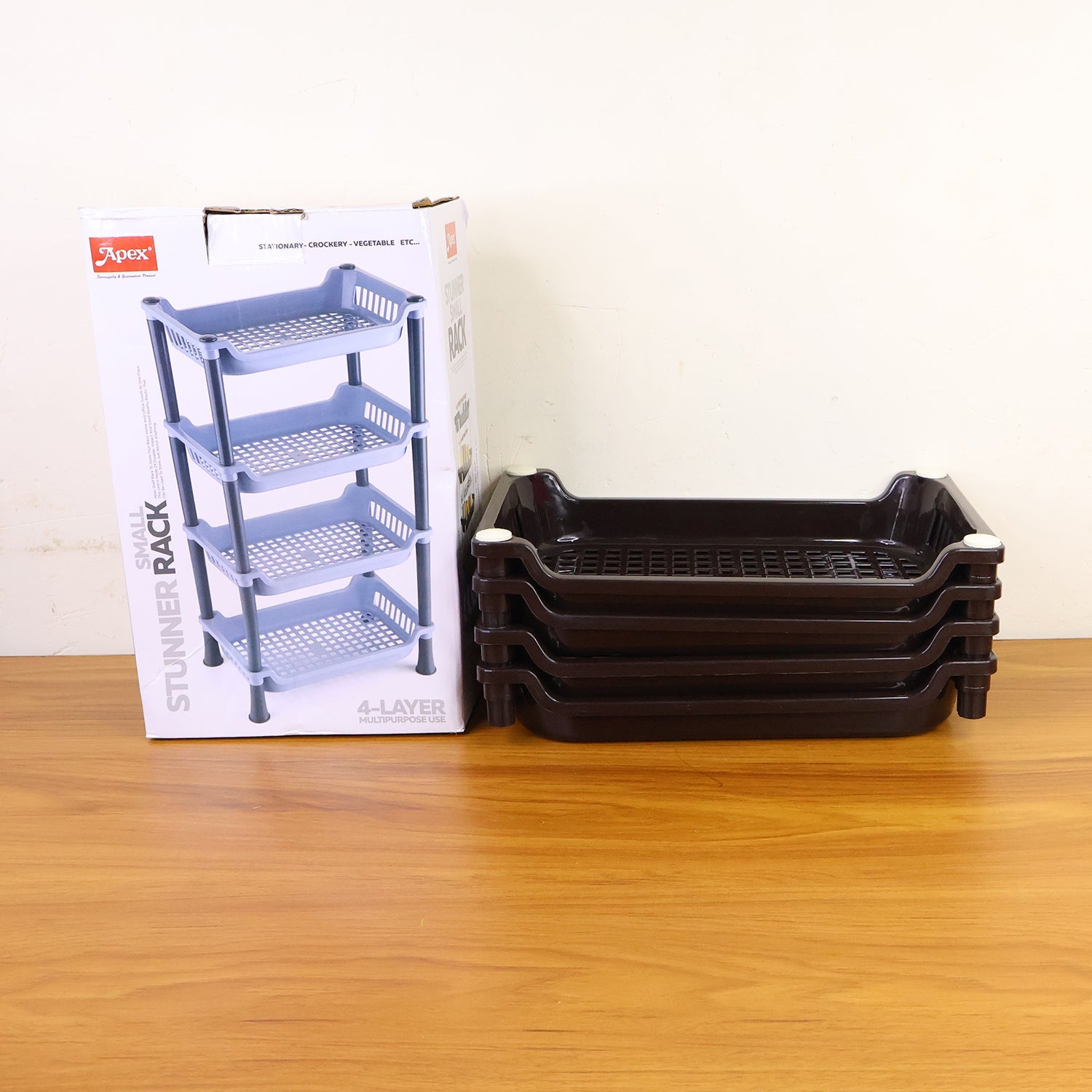 4-layer plastic storage rack setup in a kitchen showing its space-saving design