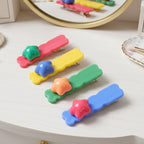 Multiple colourful star shaped hair clips displayed for fashion use