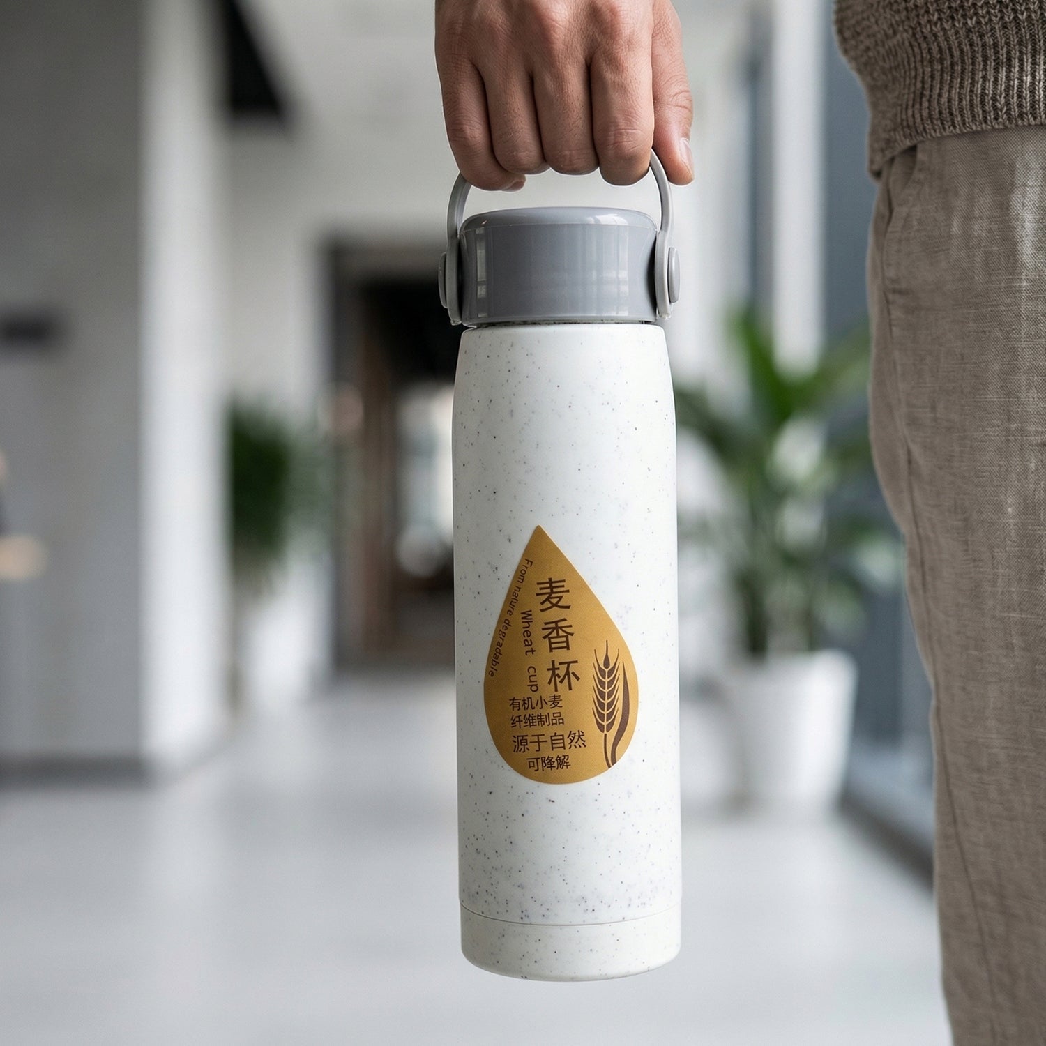 Ergonomic design of glass water bottle with phone stand