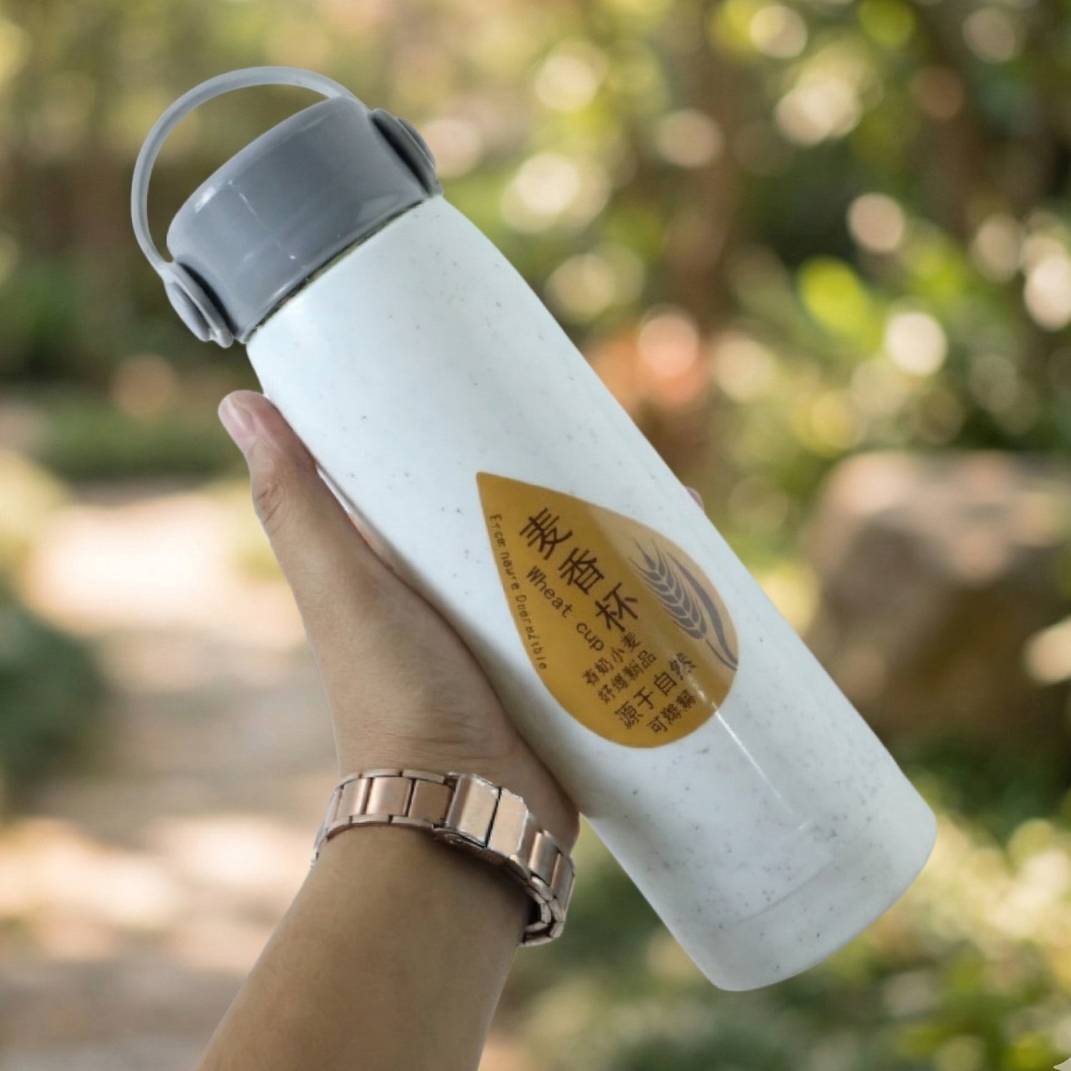Side view of portable water bottle with phone holder