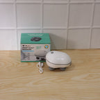 Person holding and demonstrating use of electric scalp massager