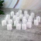 Transparent glass holder on battery-operated LED tealight candle