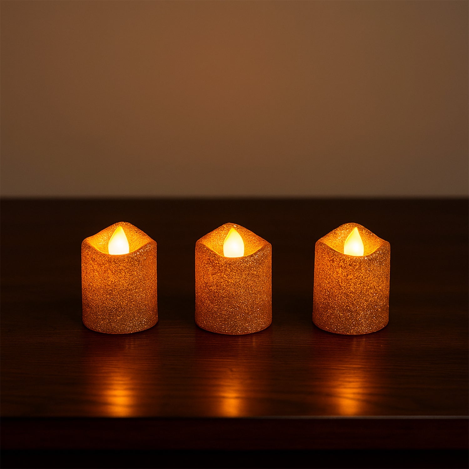 Safe flameless LED tealight candles with glitter finish on shelf