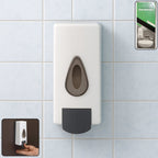Sleek wall mounted soap dispenser in a modern bathroom setting.