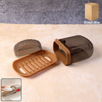 Soap box with ventilated drain tray and protective cover on bathroom countertop