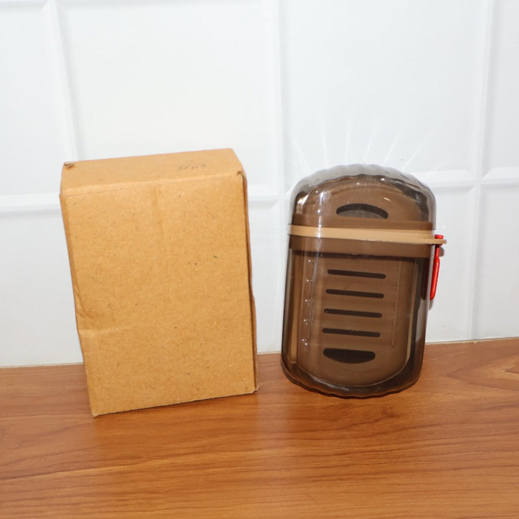 Soap box in use holding soap dry and firm on bathroom shelf