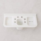Side profile of the plastic soap dish holding a bar of soap, demonstrating its practical use.