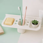 The plastic soap dish with water draining through, illustrating its effective soap saver feature.