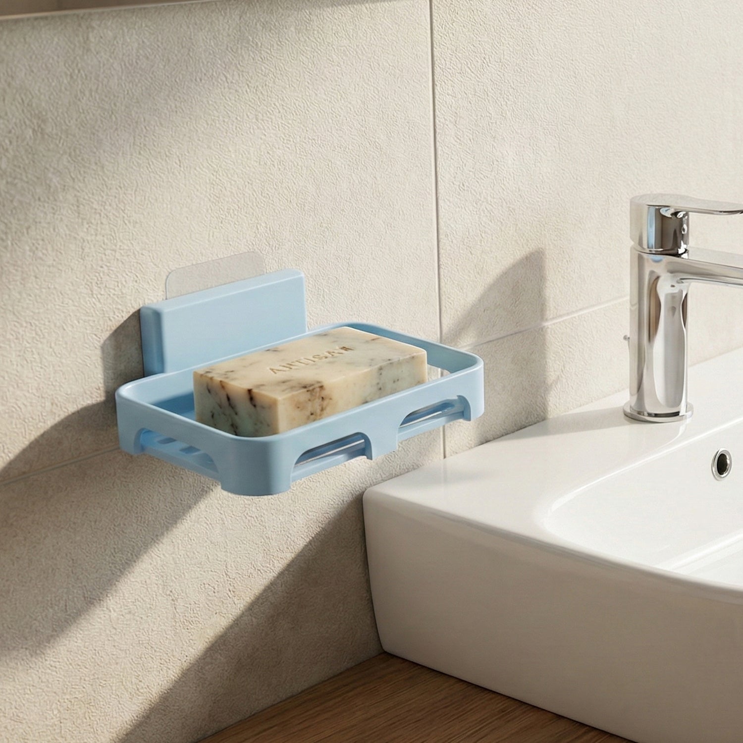 Durable plastic soap dish featuring water drainage slots