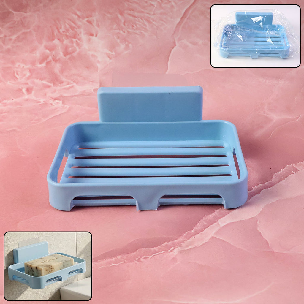 Plastic soap dish with drain slots and self-adhesive wall mount