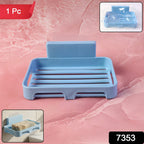 Soap dish attached to smooth bathroom tile wall
