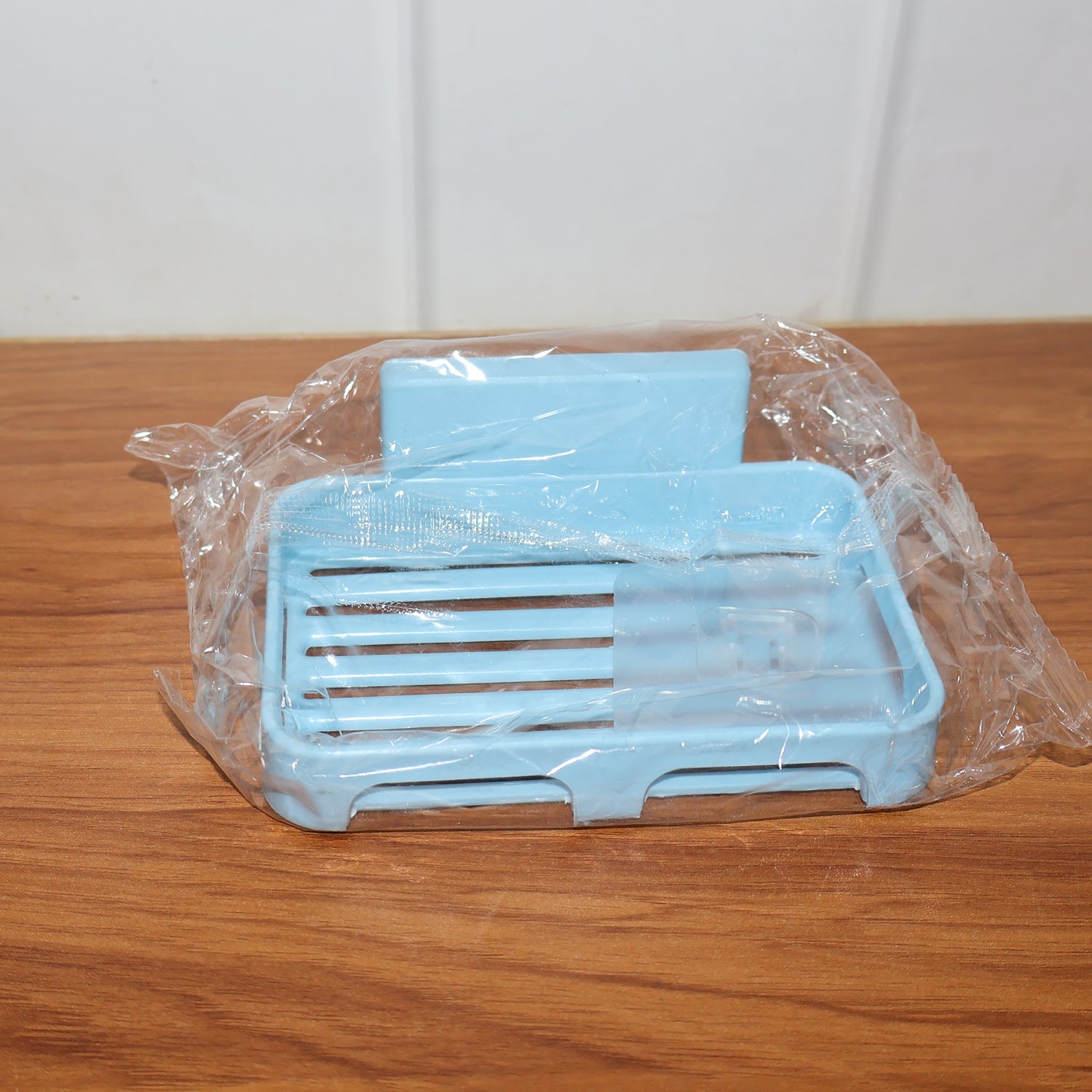 Soap dish mounted on bathroom wall showing real-world usage