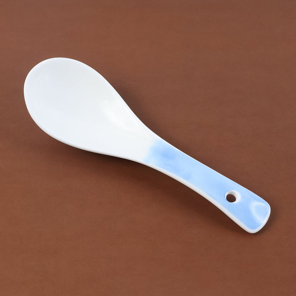 Close-up of heat-resistant ceramic serving spoon ladle
