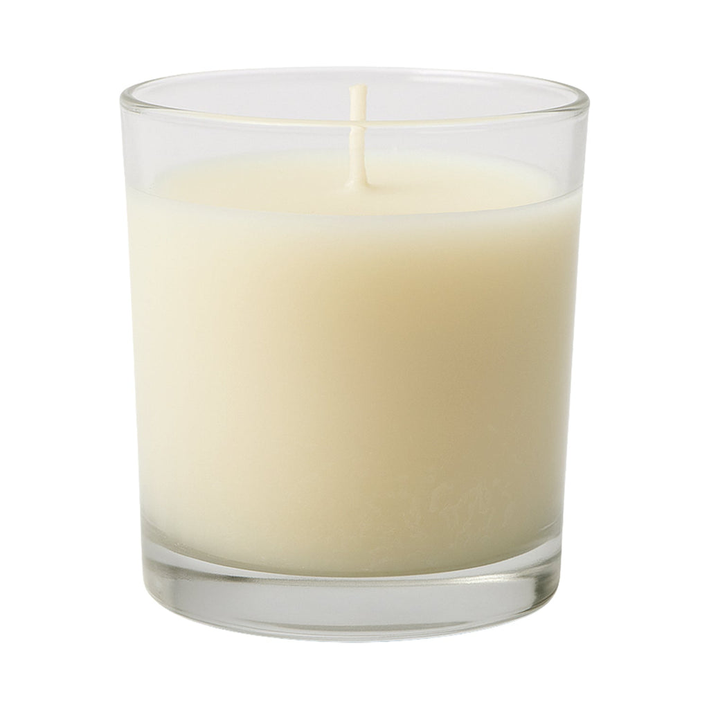 Scented votive candle adding a festive touch to Diwali decorations.