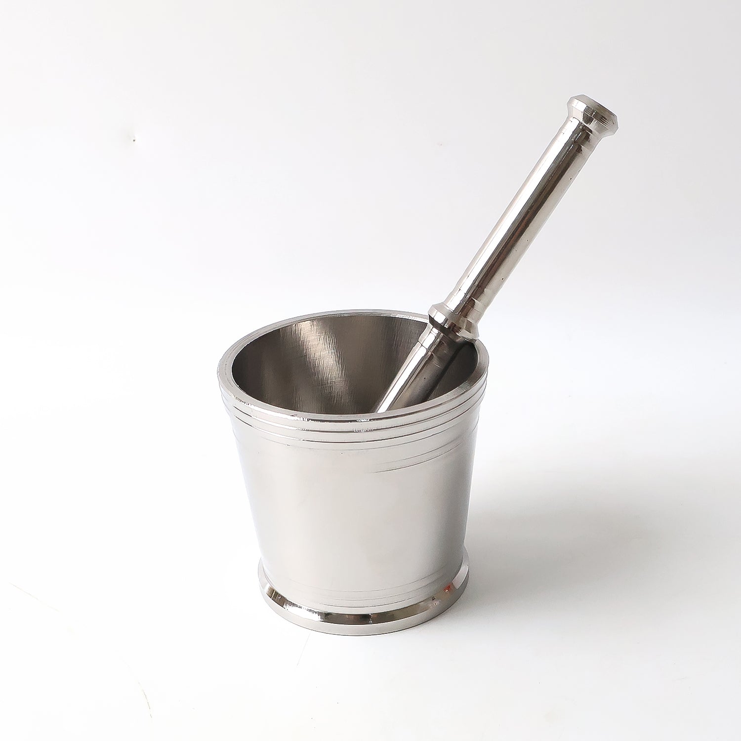 Handheld stainless steel pestle used for crushing spices