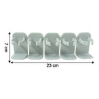 Wall mounted kitchen rack holding assorted spice jars
