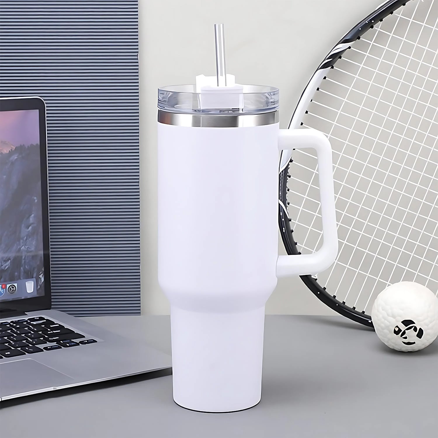 Side view of insulated stainless steel travel tumbler with straw lid