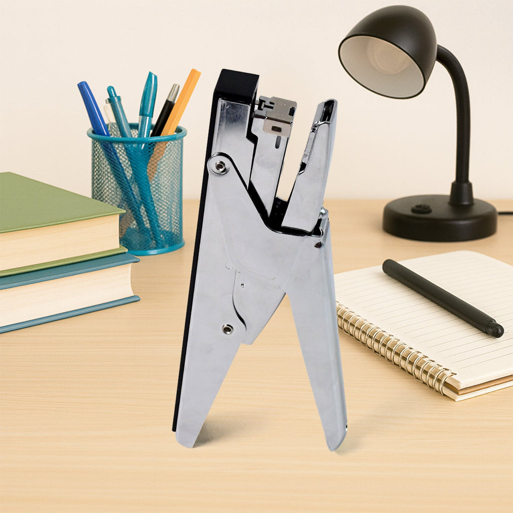 Close-up of plier stapler metal body and ergonomic handle
