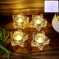 Set of 4 flameless star-shaped LED candles with warm flickering light