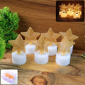 Set of 6 LED Star Candles glowing with warm flickering light on a dark surface