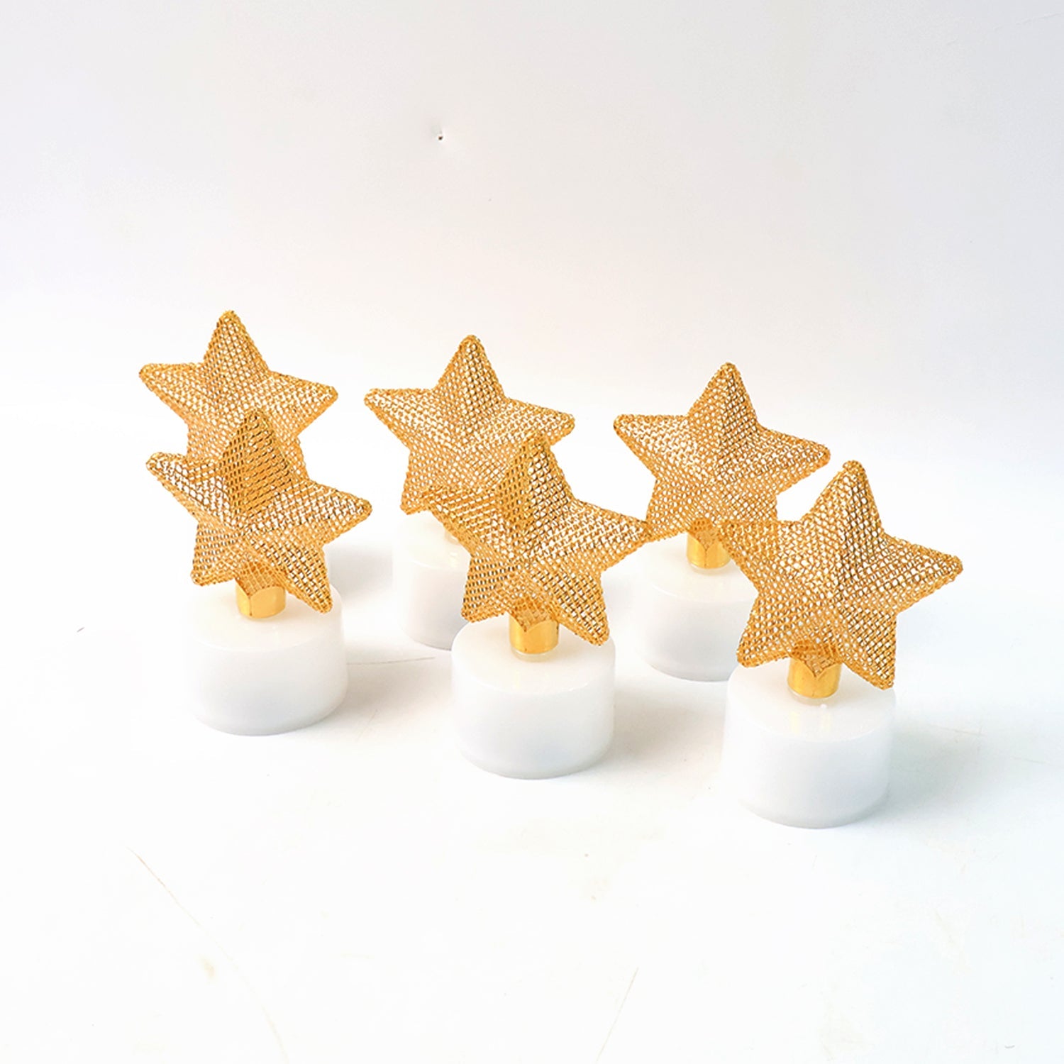 Top-down view showing a glowing LED star candle with flickering light