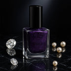 Bottle of Purple Dazzle glitter nail paint with sparkling finish